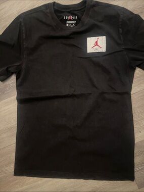 Men’s Jordan Black Tee with Red Jumpman Patch
